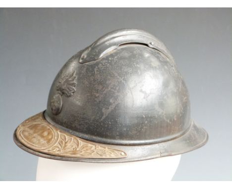 French WW1 Adrian helmet with liner and commemorative plaque to peak