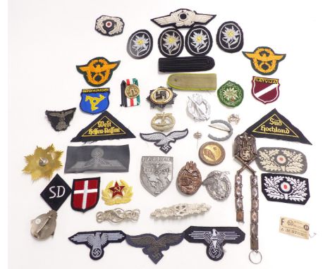 Replica mainly Nazi German badges and fabric insignia, to include enamel examples, Russian enamel badge, Luftwaffe etc