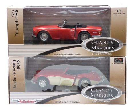 Two ERTL Grandes Marques 1:18 scale diecast model cars Austin-Healey 100/6 33838 and Triumph TR6 1974 33627, both in original