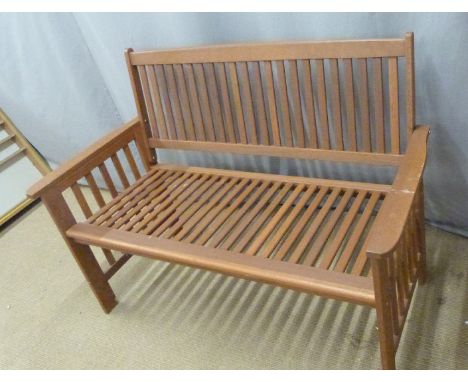 A teak or similar hardwood garden or conservatory bench, W126 x D60 x H 90cm