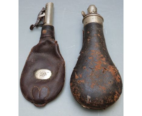 Sykes leather covered metal powder flask together with a leather shot flask, largest 21cm long.&nbsp;