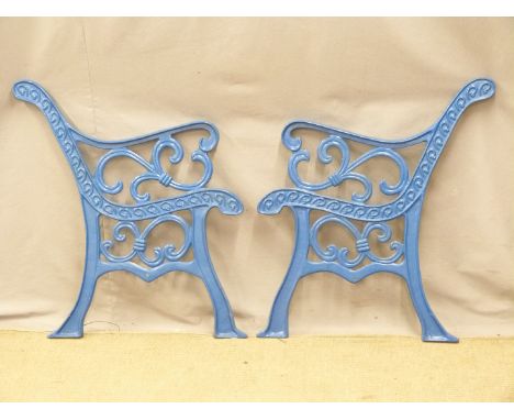 A pair of cast iron bench ends, H78cm