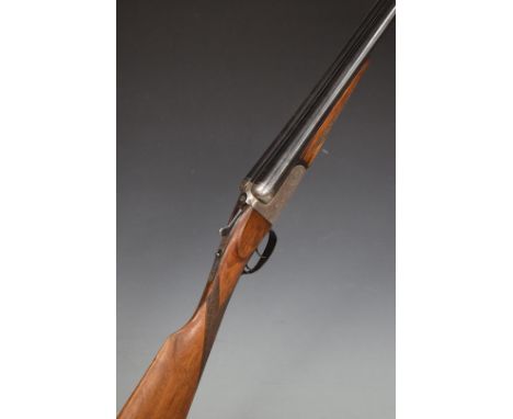 Unnamed 12 bore side by side shotgun with engraved locks, trigger guard, underside, thumb lever and fences, chequered grip an