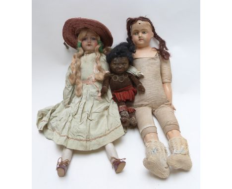 Three various dolls comprising one bisque headed with open mouth and fixed blue eyes, one with composite head, arms and legs 