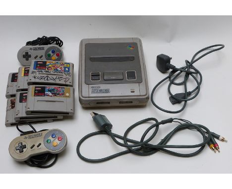 Super Nintendo Entertainment System (SNES) video games console with two controllers and six games.&nbsp;