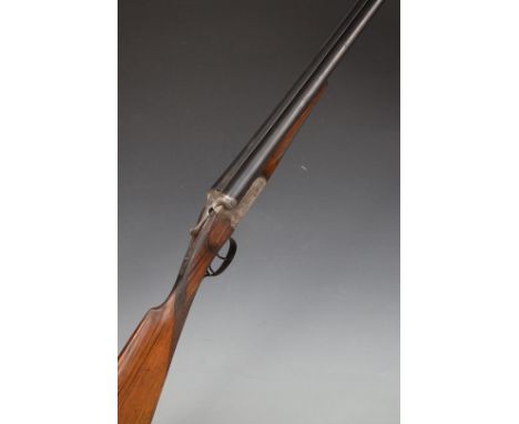 Spanish 12 bore side by side shotgun with engraved lock, trigger guard, underside, top plate, thumb lever and fences, chequer
