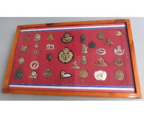 Thirty one mainly British Army badges including Northamptonshire Yeomanry, Royal West Kent, Scots Dragoon Guards etc, with RA
