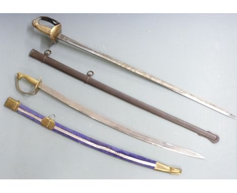 19thC sword with lion's head pommel and brass grip, 81cm curved blade and scabbard together with a 'made in India' souvenir s