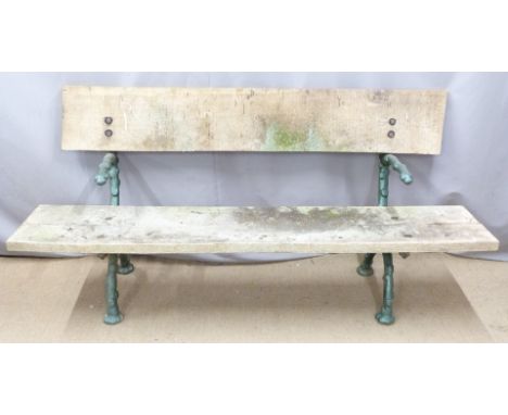 A cast metal garden bench with faux branch decoration, planked oak seat and back rest, W198 x D60 x H97cm
