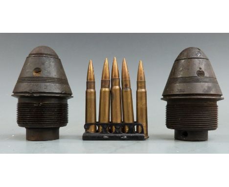 Two WWI ordnance fuses together with a clip of five practice .303 rounds