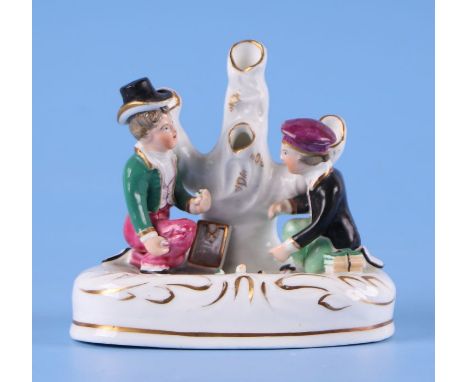 A 19th century Staffordshire pottery spill vase modelled as two boys playing marbles, 11.6cms high.Condition ReportSome sligh