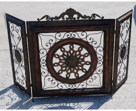 A pierced and gilded modern three-fold fire screen, 140cms extended.