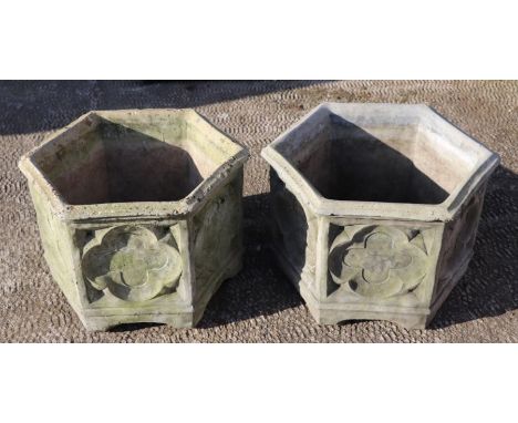 A pair of hexagonal reconstituted stone garden planters, 44cms wide (2).