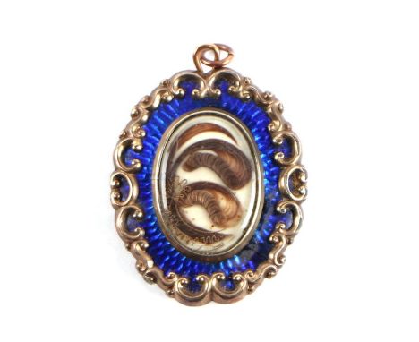 A 19th century blue enamel and hair mourning pendant, 3.5cms diameter (converted from a brooch).