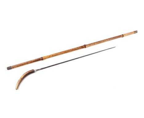 A bamboo shafted sword stick with a stag horn handle and having a 49cms (19.25ins) square section blade, no makers mark. Over