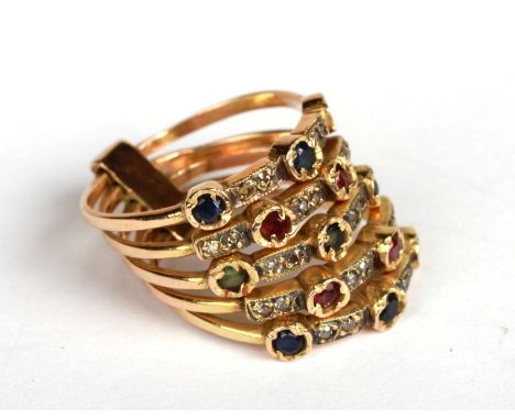 An Turkish yellow metal multi-band gem set harem ring composed of five separate bands joined at the shank, gemstones to inclu