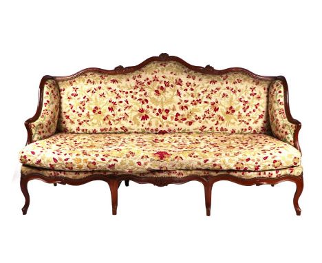 A French upholstered sofa with carved walnut show wood, 200cms wide.