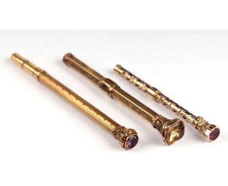 A Sampson &amp; Morden yellow metal combination dip pen and pencil, 11cms long; together with a Victorian yellow metal seal t
