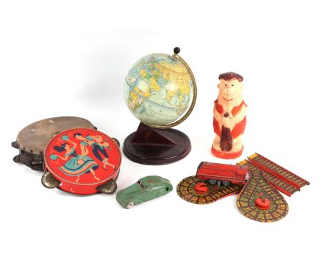 A Chad Valley tinplate terrestrial globe; together with a Mettoy tinplate clockwork train and track; and other items.