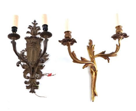 A rococo style twin-arm wall light; together with another twin-arm wall light (2).