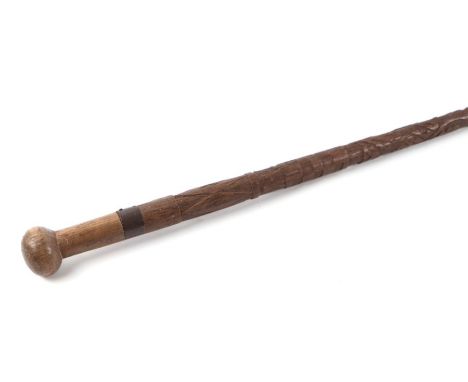 A WW1 hand carved trench art walking cane / stick. Carved into the stick it reads WORLD - WAR 1914-19 with the initials: H. L