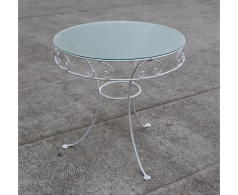 A painted wire work two-tier garden table with a circular frosted glass top, 76cms diameter.