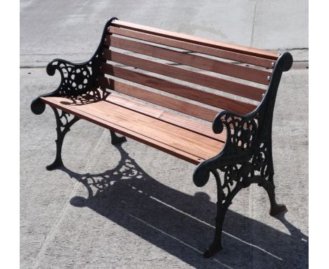 A garden bench with teak slats and cast iron ends,119cm wide.Condition Reportsome of the seat slats are missing the fixings