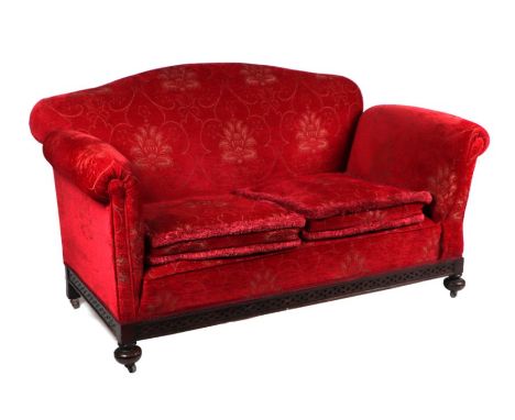 A late Victorian / Edwardian upholstered drop-arm two-seater sofa, 148cms wide.