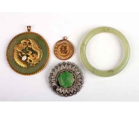 A Chinese yellow metal pendant, 4.3g; together with a Chinese gold coloured metal mounted pendant; a silver filigree and jade
