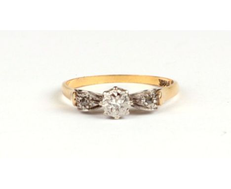 An 18ct gold and platinum three-stone diamond ring, approx UK size 'O', 2.2g.