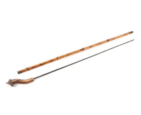 A bamboo shafted sword stick with a stag horn handle and having a 69.5cms square section blade, no makers mark. Overall lengt