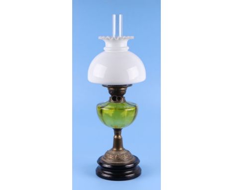 A Victorian oil lamp with green glass reservoir and opaque white glass shade, approx 60cms high.