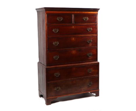 A George III mahogany chest on chest, the upper section with a moulded cornice above two short and three graduated long drawe