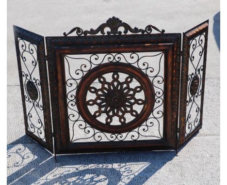 A pierced and gilded modern three-fold fire screen, 140cms extended.