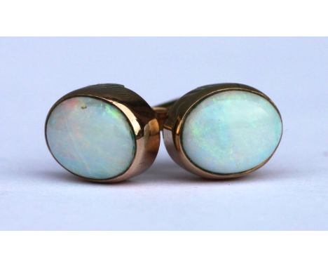 A pair of 9ct gold opal stud earrings.