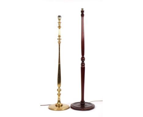 A brass standard lamp with slender baluster form columns 128cms high; another wooden example, 137cms high together with a bra