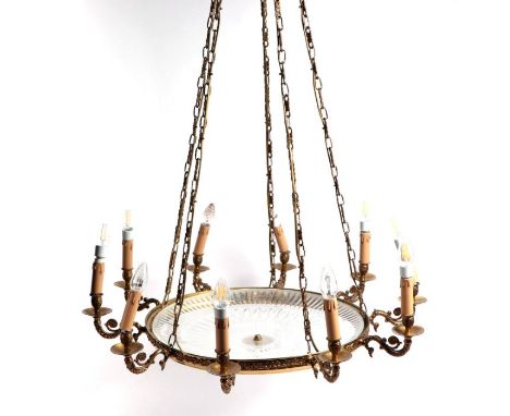 A cut glass and brass ten-arm ceiling light, 84cms wide.