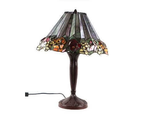 A Tiffany style table lamp together with a similar mantle clock.(2)