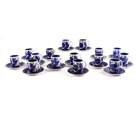 Fifteen Boch coffee cans and saucers decorated with blue &amp; white leaf design.