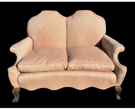 An upholstered two-seater sofa with feather cushions, on cabriole front supports, 167cms wide.