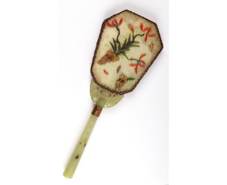 A Chinese hand mirror with jade / hardstone handle and applied coral flower decoration, 28cms long.