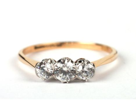 An 18ct gold and platinum three-stone moissanite ring, approx UK size 'P', 2.1g.Condition ReportThe ring is in general good c