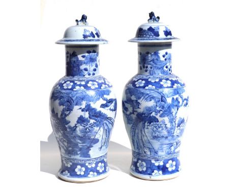 A pair of Chinese blue &amp; white baluster vases and covers decorated with birds and foliage, 49cms high (2).Condition Repor