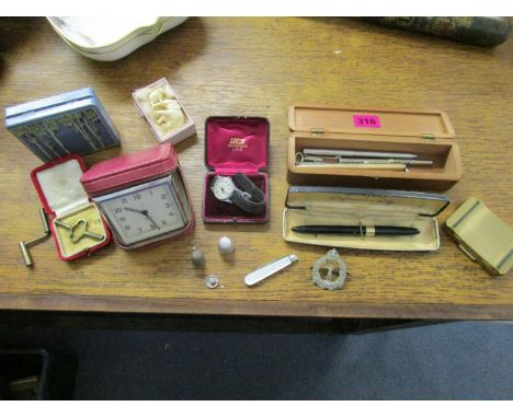 A Smith wristwatch and a cased Smiths alarm clock, along with a 14k gold nib, a Sheaffer fountain pen, a Stratton compact and