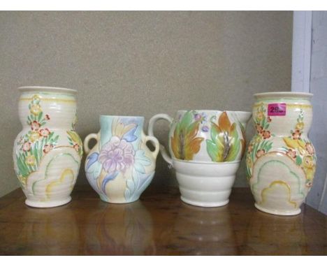 A Clarice Cliff jug, a pair of Crown Devon floral vases and a Beswick floral twin handled vase 