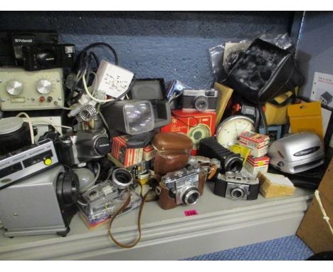 A quantity of mixed cameras and accessories to include a Polaroid camera and an Olympus digital camera 