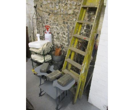 A selection of gardening items to include a pick axe, spades, a parasol, galvanized buckets, garden sprayers, commemorative D