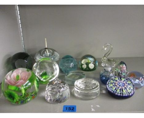 A quantity of glass paperweights to include Caithness 