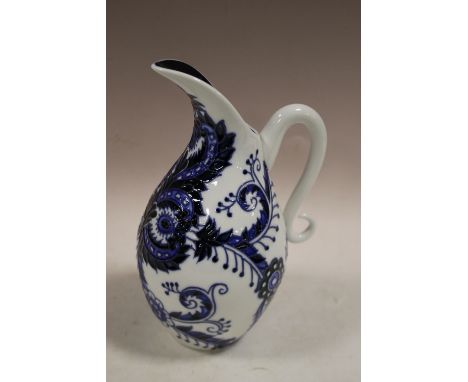 A BOXED OLD TUPTON WARE CERAMIC JUG