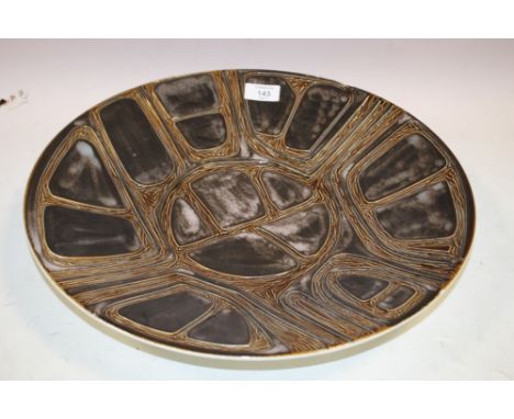 A LARGE POOLE STUDIO POTTERY CHARGER WITH INCISE DECORATION, brown tonal glaze, painted marks to base, Dia. 41 cm